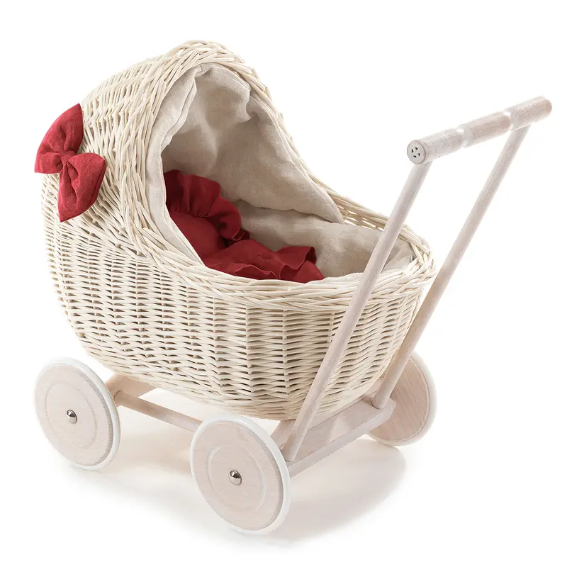 Desayer wicker doll stroller with linen trim and red bedding, featuring a handle, quilt, and pillow TheWickerStories