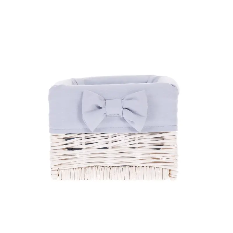 Nova wicker storage basket with blue trim and bow TheWickerStories