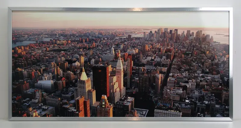 Obraz Manhattan w promieniach wschodzącego słońca 100x50 cm